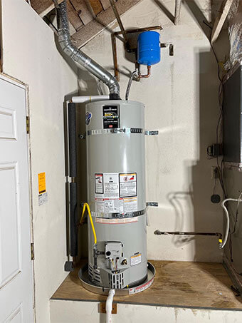 Gas water heater installation with an expansion tank and new supply lines